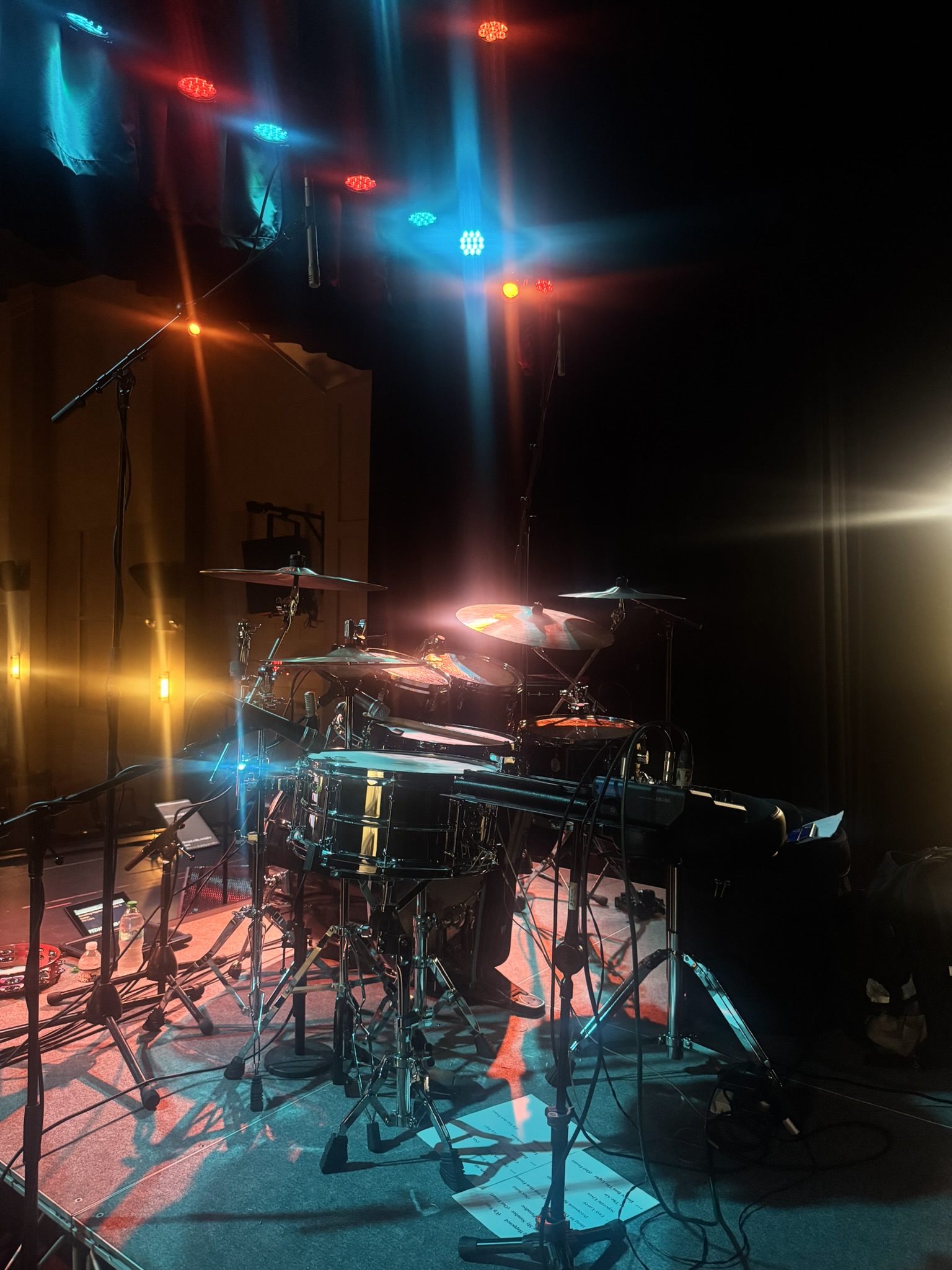 Stage and drum setup under event lighting